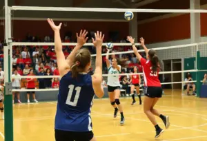 University of Dayton volleyball players competing in a match