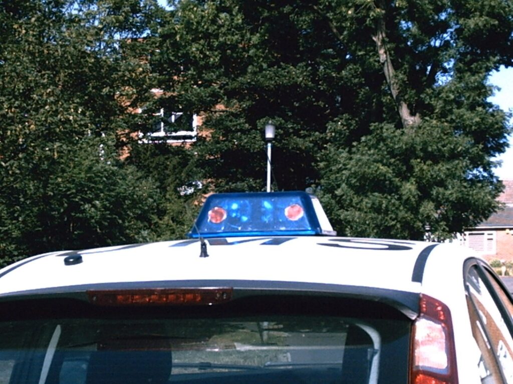 Police car with emergency lights on the roof